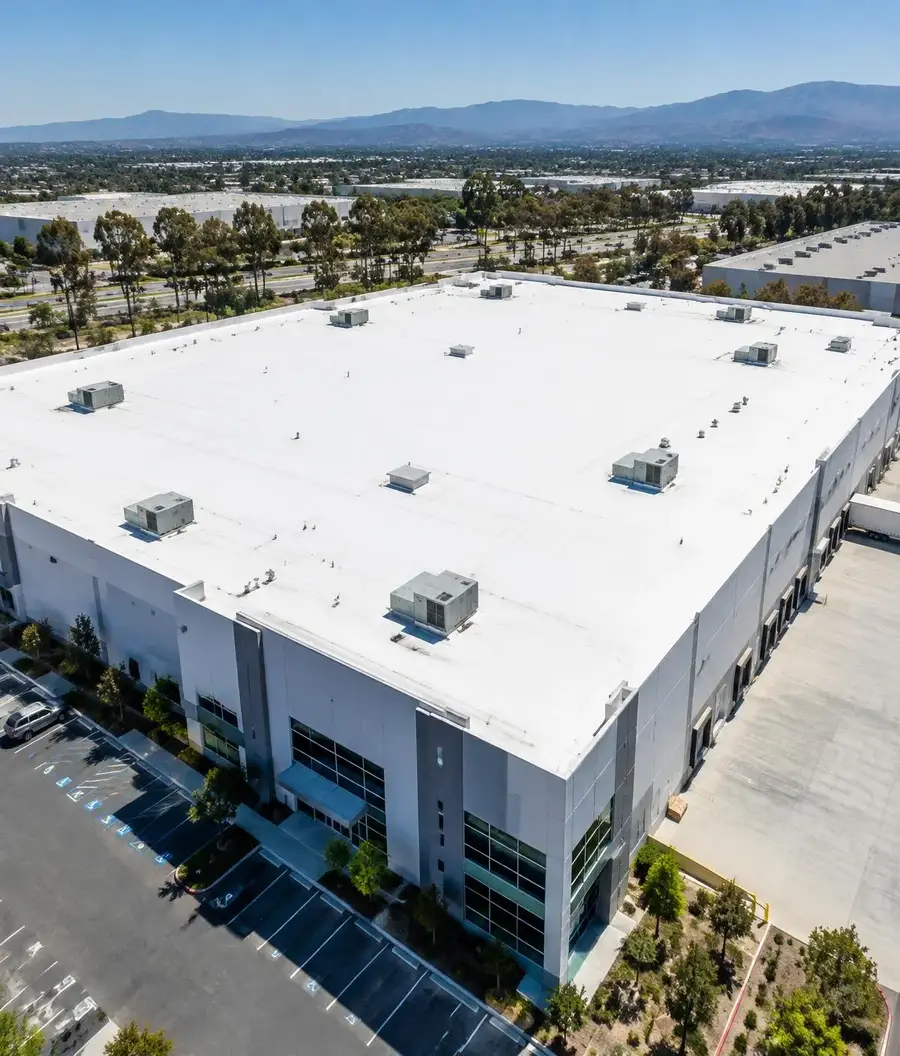 Commercial warehouse with a white flat roof